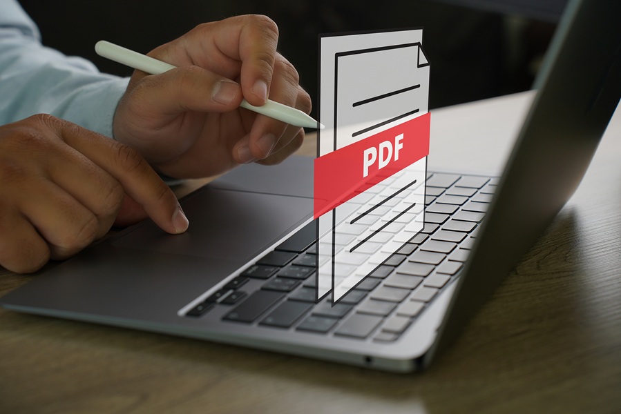 Icona di un file PDF davanti ad un computer